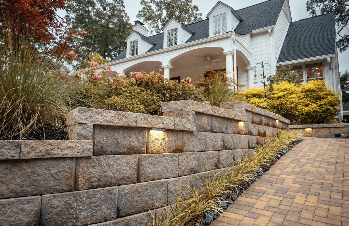 Custom natural stone masonry retaining wall and paver walkway in Beaumont, TX